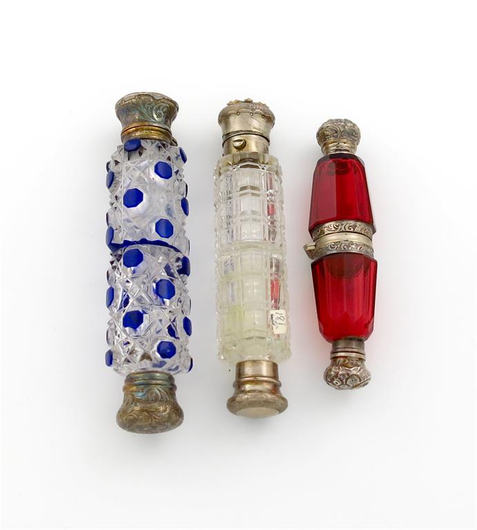 A Victorian silver-gilt mounted double-ended scent bottle, unmarked, cylindrical form, hobnail cut