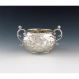A Charles II silver two-handled porringer, maker's mark partially worn, ?R with a crescent above,