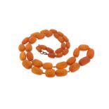 A graduated amber bead necklace, 82cm. 65g.