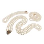 A two row cultured pearl necklace, with a geometric design sapphire and diamond clasp C1970. A two