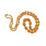 A graduated amber bead necklace, 93cm. 68g.