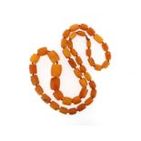 A graduated amber bead necklace, 80cm, 80g.