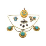A Victorian gold necklace, suspending three circular gold discs set with turquoise cabochons. A gold