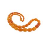 An amber bead necklace, 68cm. 52g.