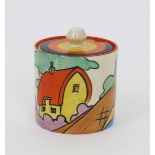 'Orange Roof Cottage' a Clarice Cliff Fantasque Bizarre Cylindrical preserve pot and cover,