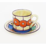 'Circle and Squares' a Clarice Cliff Fantasque Bizarre Tankard coffee can and saucer, painted in