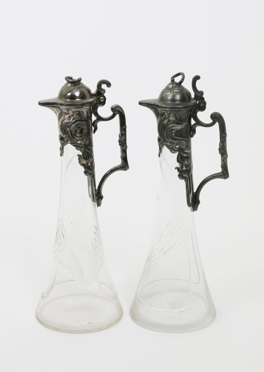 A pair of W.M.F pewter and glass decanters, with hinged covers, the cast with flowers, the glass - Image 2 of 2
