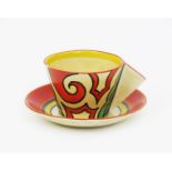 'Arabesque' a Clarice Cliff Bizarre Conical tea cup and saucer, painted in colours 7.5cm. high