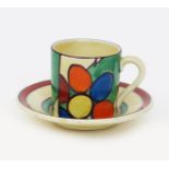 'Pebbles' a Clarice Cliff Fantasque Bizarre Tankard coffee can and saucer, painted in colours