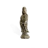 A LARGE CHINESE BRONZE FIGURE OF GUANYIN EARLY QING DYNASTY Standing on a cloud base, wearing long