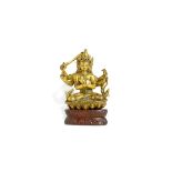 A CHINESE GILT BRONZE FIGURE OF MANJUSARI 17TH/18TH CENTURY The six-armed figure with three faces,