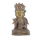 A CHINESE GILT BRONZE MODEL OF GUANYIN MING DYNASTY Seated with her legs crossed in dhyanasana and