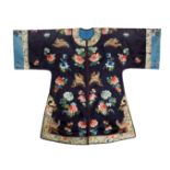 A CHINESE SILK ROBE LATE QING DYNASTY Decorated with colourful butterflies and large flower blooms