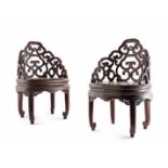 A PAIR OF CHINESE TIANQI BROWN LACQUER LOW ARM CHAIRS 18TH CENTURY With oval seats and intricate