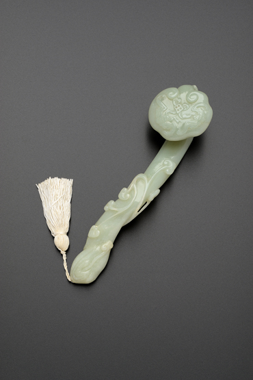 A CHINESE PALE CELADON JADE RUYI SCEPTRE 19TH/20TH CENTURY Carved naturalistically with fungi and