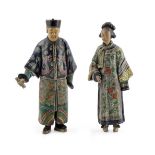 A RARE PAIR OF CHINESE POTTERY FIGURES C.1800 Modelled as a man and a woman, each standing wearing