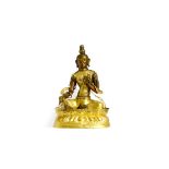 A CHINESE BRONZE AND GILT COPPER REPOUSSE FIGURE OF GREEN TARA QING DYNASTY Sitting on a lotus