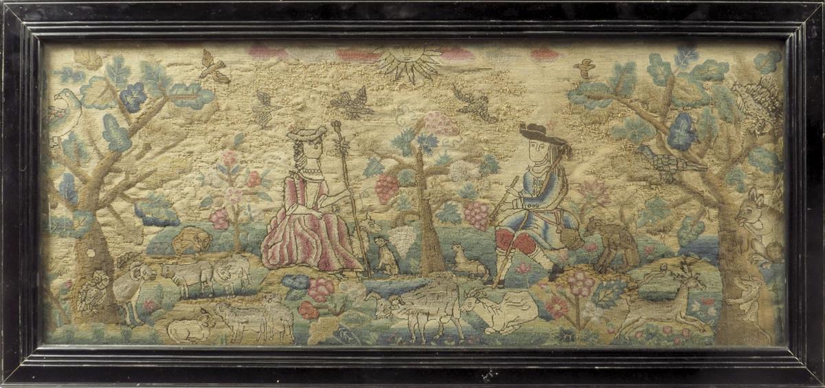 A needlework picture, worked in wool with some raised work, depicting a shepherd and shepherdess