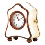 λ A miniature ivory and tortoiseshell timepiece, circular white enamel dial, movement with the