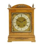 A German burr walnut veneered mantel clock, striking movement by Lenzkirch with 6.5 inch brass dial,