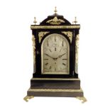 A large English ebonised quarter chiming mantel clock, the 8 inch silvered dial with florally