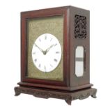 A Chinese hardwood quarter striking verge bracket clock, circular 6.5 inch white enamel dial with