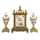 A French brass and porcelain clock garniture, striking movement by Japy Freres no. 8418, numbered