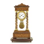 λ A French portico clock, white enamel dial with faded signature a Fontainebleu, striking drum