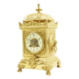 A French brass mantel clock, cream enamel annular chapter ring with Arabic numerals, striking