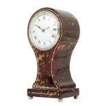 λ A tortoiseshell balloon mantel timepiece, white enamel dial, French movement no. 10077 with