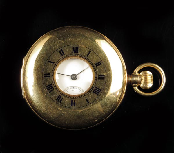 An 18ct gold half hunting cased lever watch, Swiss gilt movement, white enamel dial, in a