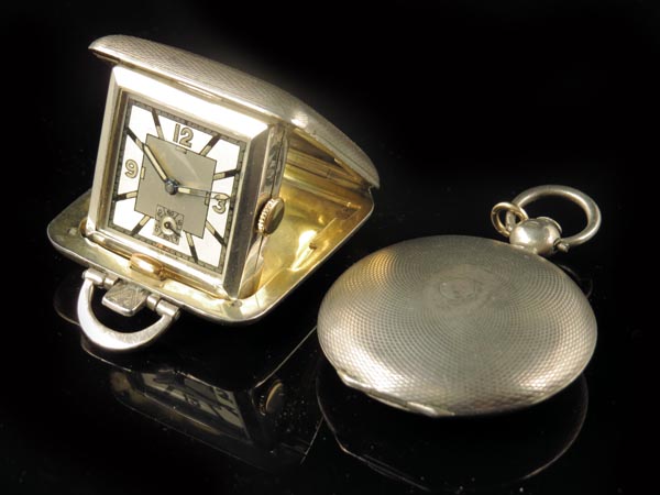 A continental silver hunting cased verge watch, winding through the white enamel dial, in a
