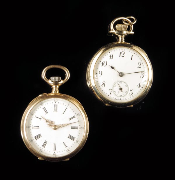 A Swiss gold keyless cylinder watch, white enamel dial, in a guilloche case, 30mm diameter; and a