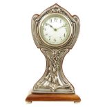 A French mahogany mantel timepiece with silver front, drum movement with cylinder platform, in a