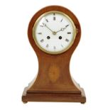 A French balloon mantel clock, the 5 inch enamel dial with Roman numerals, striking drum movement