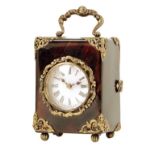 λ A miniature tortoiseshell carriage timepiece, circular white enamel dial, French movement with