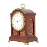 A French mahogany mantel timepiece, white enamel dial, drum movement with lever platform, in a break