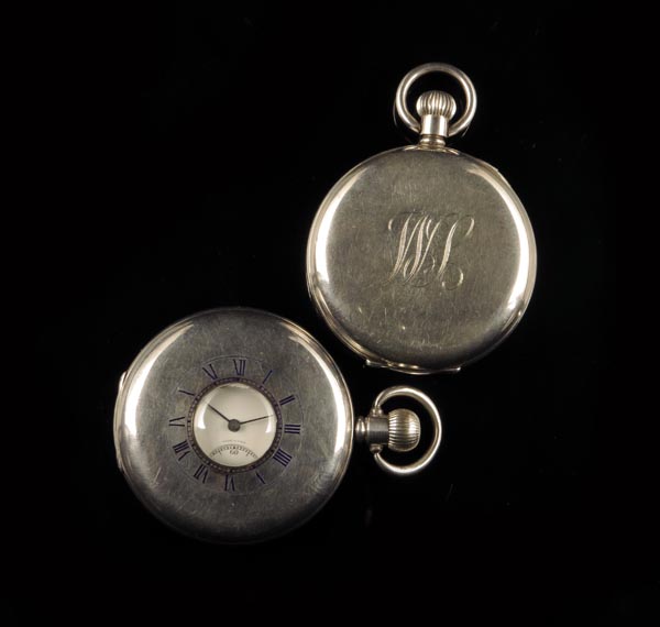 A silver hunting cased keyless lever watch, the white enamel dial and Swiss gilt movement signed J.