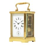 An alarum carriage clock, the striking movement stamped EGL, white enamel dial with subsidiary alarm