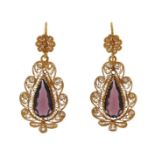 A pair of 19th century gold filigree and purple paste earrings, the pear-shaped stones set within