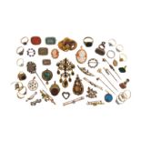A large collection of jewellery, including a diamond set gold heart-shaped brooch, a garnet and seed