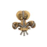 A diamond set gold Prince of Wales feathers brooch, engraved Ich Dien. 4.5cm high.
