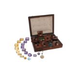 A quantity of gem stones and synthetic stones, including amethysts, citrines and garnets.