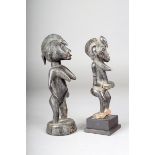 Two Senufo standing female figures, Ivory Coast, 20.5cm and 16.5cm high, the smaller with a