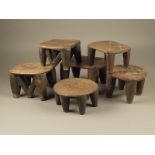 Six Nigerian wood stools, with geometric patterned tops, two with 'V' shape supports, the highest