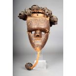 A Salampasu mask, D.R.Congo, with woven ball coiffure, the face with sectional sheet copper with