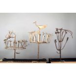 Three Bambara iron staffs, modelled birds, figures and symbols, 61cm, 71.5cm and 76.5cm high. (3)