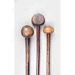 Three Zulu hardwood knobkerries, South Africa, one with a flat sided spherical head, 66.5cm, 72cm,