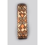 An Asmat shield, Papua New Guinea, rectangular with relief carved decoration with pigment finish,