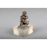 An Ashanti brass gold weight, mother and child on a stool, 4.7cm high, on a perspex base. Provenance